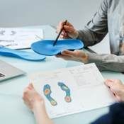 Comprehensive assessment of posture, walk and feet with custom orthotic insoles